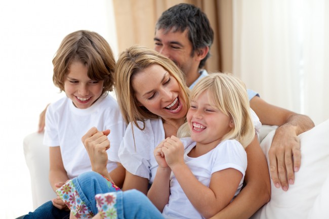 bigstock_happy_family_relaxing_on_the_s_6558303